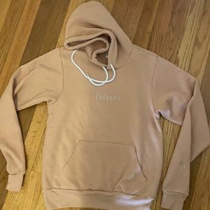 Hims tan hooded sweatshirt.